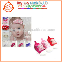 Girls toddler sport shoes and beautiful flowers of baby shoes